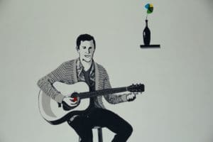 creative painting of person playing guitar